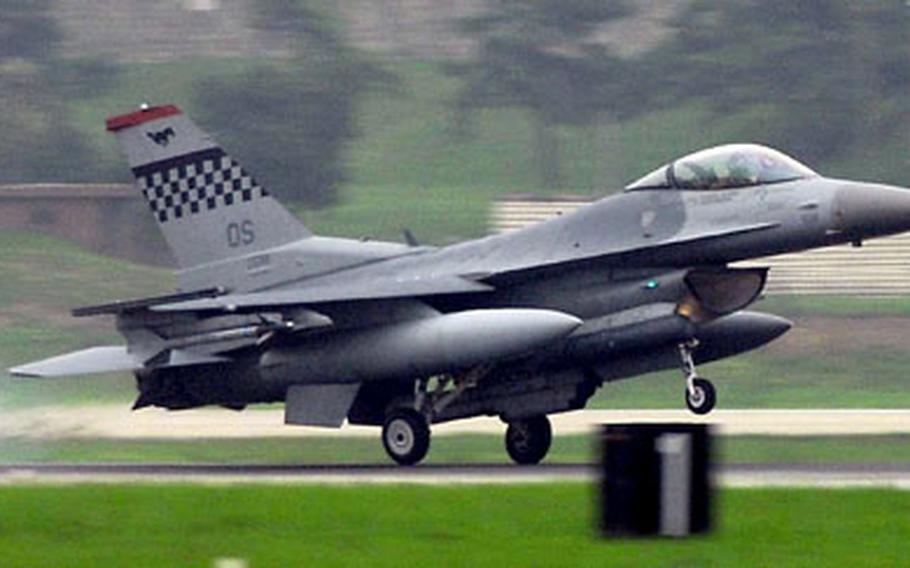 At Osan Air Base in South Korea last July, an F-16 fighter of Osan’s 36th Fighter Squadron lands after flying a mock combat mission during a training exercise. This week the U.S. Air Force throughout South Korea is holding an exercise to test its readiness to fight an air war.