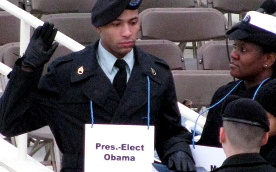 Army Staff Sgt. Derrick Brooks of Fayetteville, N.C., has the honor of filling in for President-Elect Barack Obama during a rehearsal for the upcoming inaugural ceremony Sunday, January 11, 2009 at the Capitol in Washington, D.C. At right, representing Michelle Obama, is Navy Yeoman 1st Class LaSean McCray of Miami, Fla.