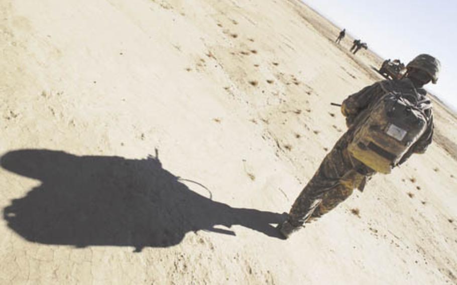 Sgt. James Kendall and other members of Company C, 1st Battalion, 506th Infantry Regiment return to their vehicles after a patrol in Paktika province. These troops are nearing the end of their year-long deployment, as is the rest of the 4th Brigade, 101st Airborne Division.