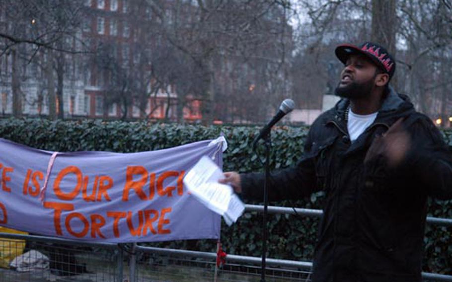 Mohammed Yahya, a British hip hop artist, recites a poem during a demonstration outside the U.S. Embassy in London on Sunday calling for the closure of the detention center at U.S. Naval Station Guantanamo Bay.