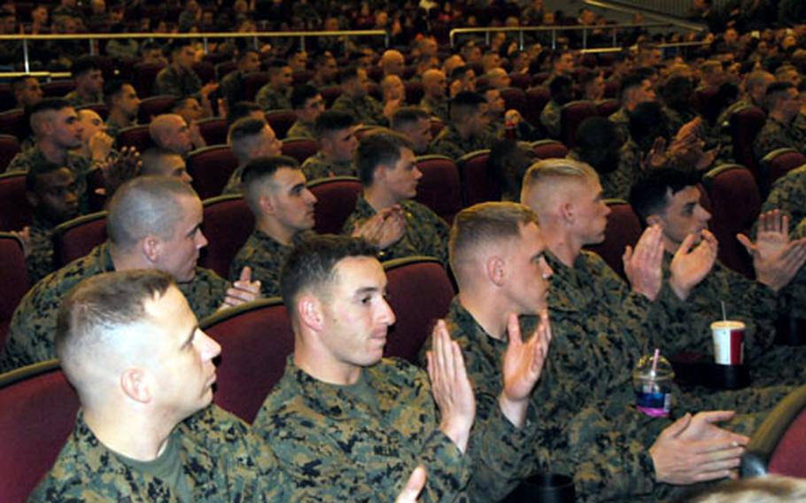 Marines applaud after Bernie Inman&#39;s presentation during a Back in the Saddle safety brief Tuesday at the Camp Foster Theater. Inman will be on Okinawa for about two weeks, speaking at other Marine bases about his experience.
