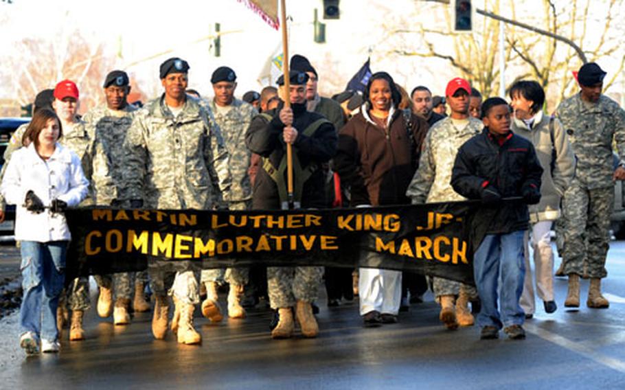 Members of the Kaiserslautern, Germany, military community march through the streets of the Vogelweh installlation, following a program commemorating Martin Luther King, Jr.&#39;s birthday on Thursday.