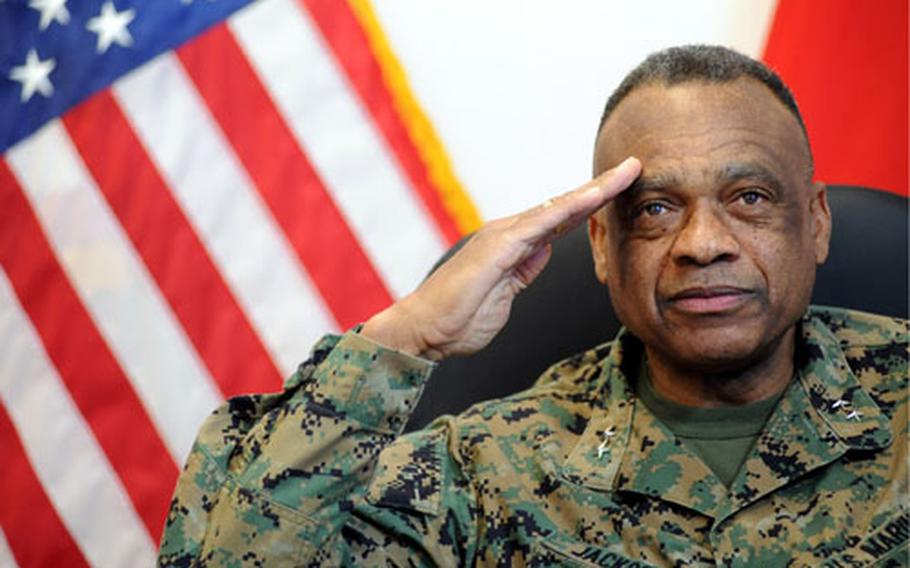Maj. Gen. Anthony Jackson, U.S. Africa Command&#39;s director of operations and logistics, salutes while telling a story of junior black soldiers: "They hadn&#39;t seen a black officer. They were stunned. And then there was the realization that I was an officer and they better whip out a salute," he said. "You could tell by that look in their eyes that it was a special thing."