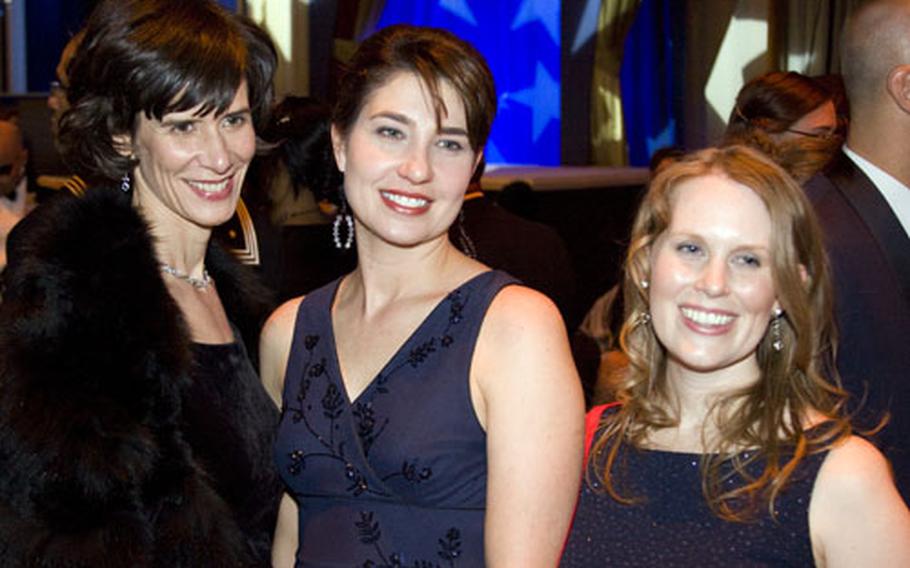 Navy wives Kate Nesbitt, Jodi Hofmann, and Rebecca Schmitt, left to right, were invited to the ball while their husbands are deployed to Iraq and Afghanistan.