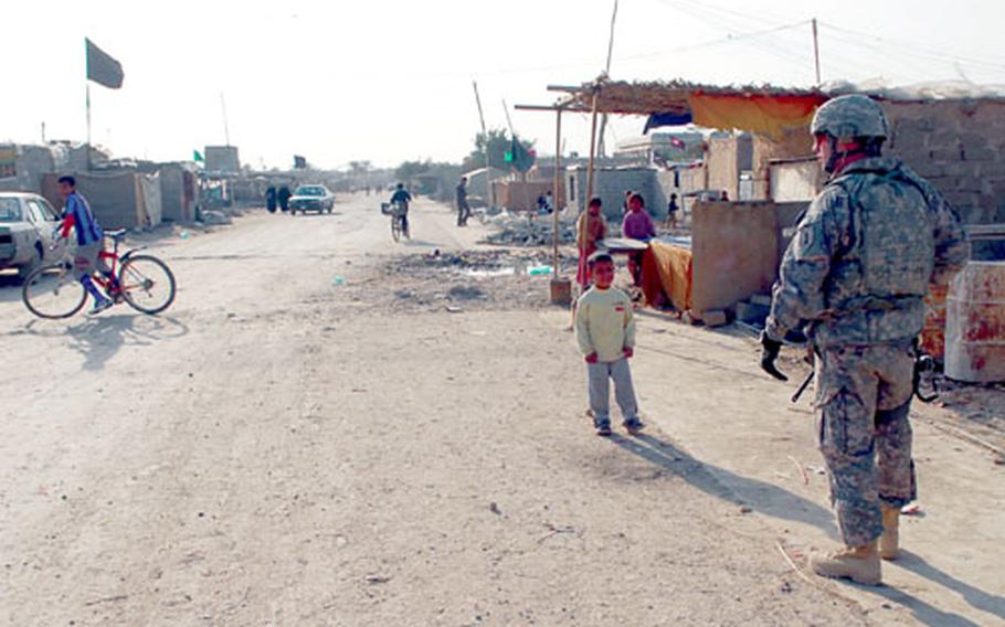 A 2nd Heavy Brigade Combat Team, 4th Infantry Division soldier watches over the streets of Chirkuk on Saturday. Chirkuk is one of 33 squatters villages – which the army calls “internally displaced persons clusters” – in Baghdad’s Kadimiyah district. Sectarian fighting forced those in Chirkuk from their former homes. But unlike many other IDPs, they don’t own property in their old neighborhoods and have nowhere to return.