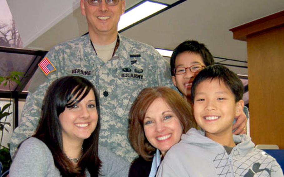 The Berdine family — from left to right in front, Jessica, Elizabeth, D.J. and, left to right in back, Dan and Danny — get together at the Town House food court at Yongsan Garrison, South Korea. The family is still in the process of adopting Danny. When completed, he will be the second son they’ve adopted from the Hwa Sung Babies Home, an orphanage in Seoul.