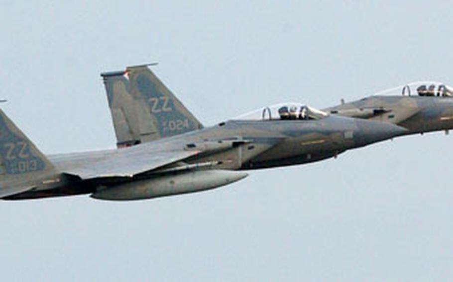 Two F-15s take off from Kadena Air Base in Okinawa Tuesday to participate in a combat scenario for the 18th Wing’s Turkey Shoot competition.
