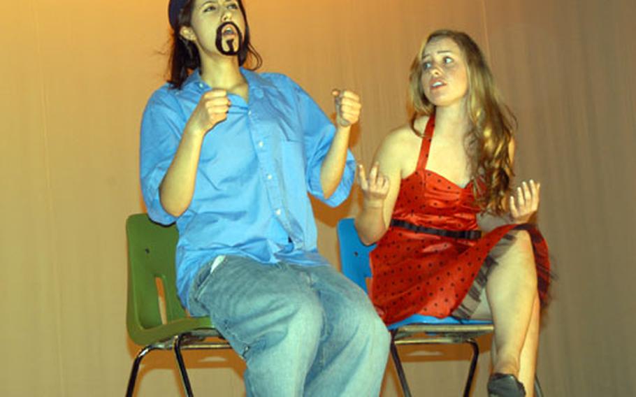 Elsa Moreck, left, and Emily Ashby, perform a reading adapted from humor columnist Dave Barry’s "Lost in Transmission" on Tuesday at Kubasaki High School on Okinawa.