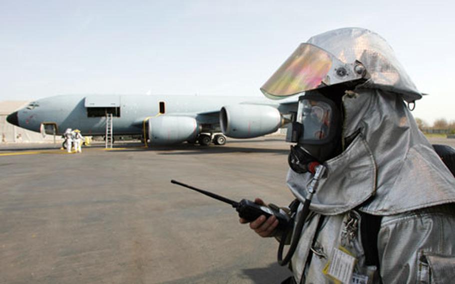 A U.S. serviceman stands in front of S-135 aircraft at the U.S. Manas Air Base, near the Kyrgyz capital of Bishkek, on April 14, 2007.