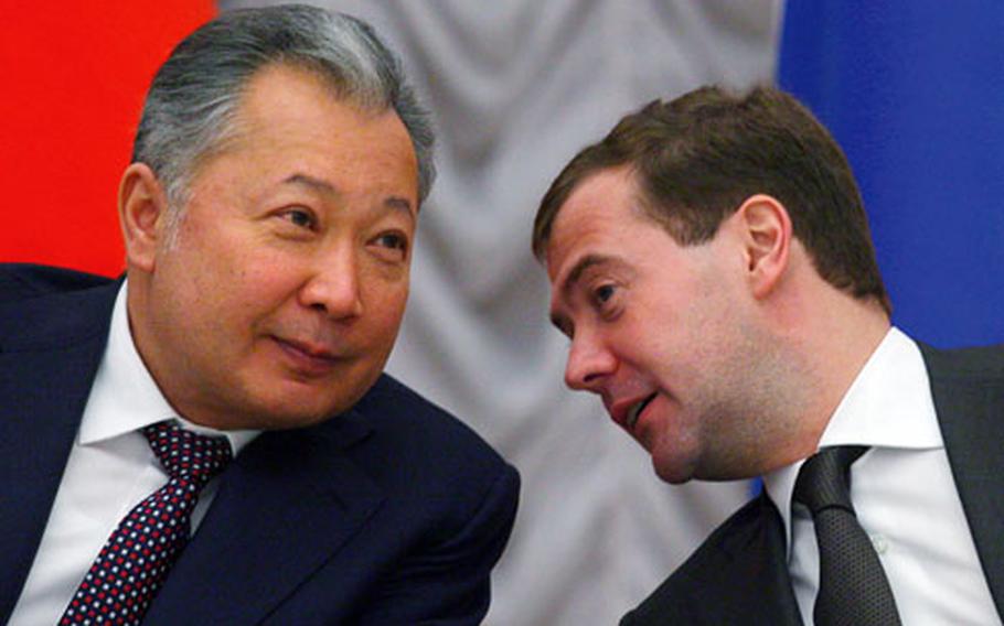 Russian President Dmitry Medvedev, right, speaks with Kyrgyz President Kurmanbek Bakiyev during a signing ceremony at the Kremlin in Moscow on Tuesday. Bakiyev said his country is ending U.S. use of the base.
