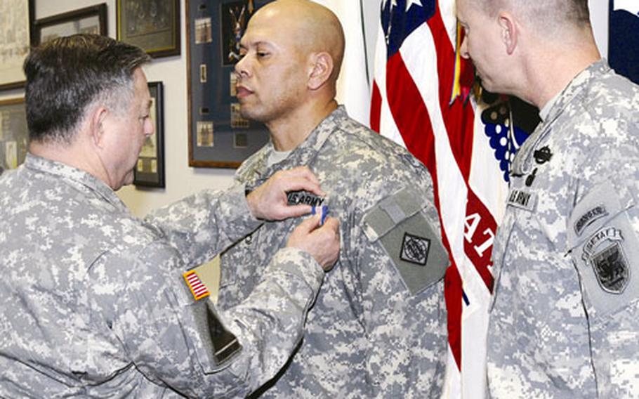 Lt. Gen. R. Steven Whitcomb, left, U.S. Army inspector general, pins the Soldier’s Medal on Sgt. 1st Class Keith Cade. Cade risked his life to rescue a woman and her child from a burning car wreck in east Texas while on leave from Afghanistan in 2005.