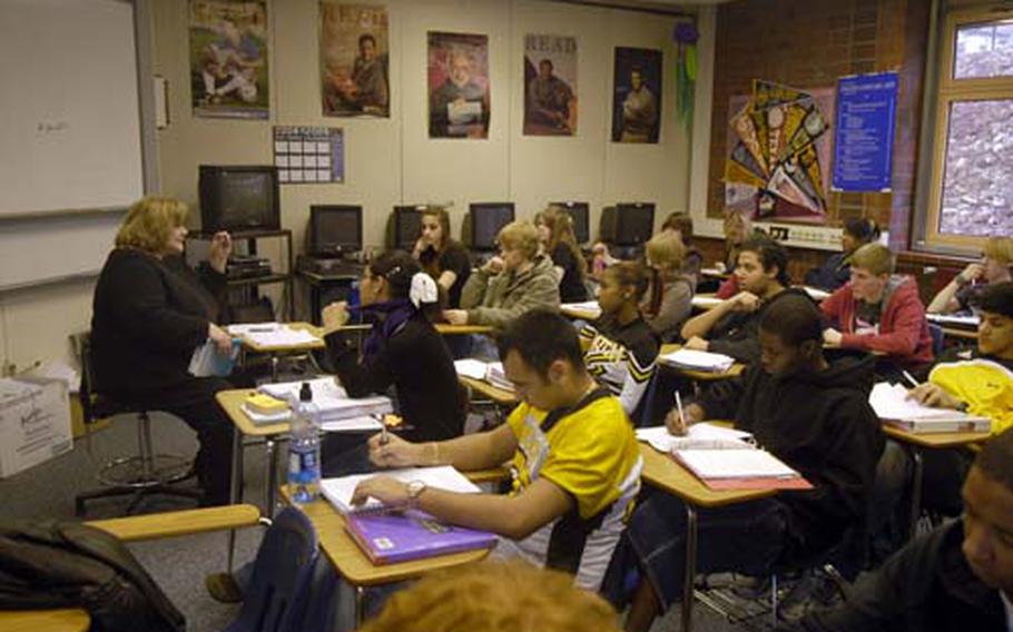 Riki Johnston, a language arts instructor, teaches to a classroom full of students at Patch High School, where insufficient space is increasingly becoming a problem. Three teachers are without classrooms of their own and 17 other teachers share rooms.