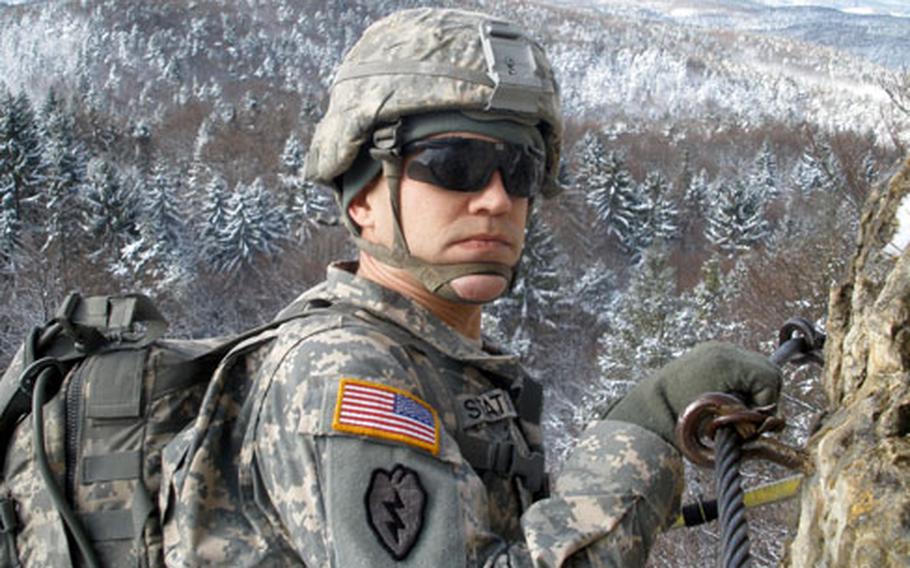 Sgt. Jason Staton, 30, of Cedar Rapids, Iowa, wasn't fazed by the altitude during a rock-climbing trip that was part of Warrior Adventure Quest. For more photos, see the link at the top of the story.