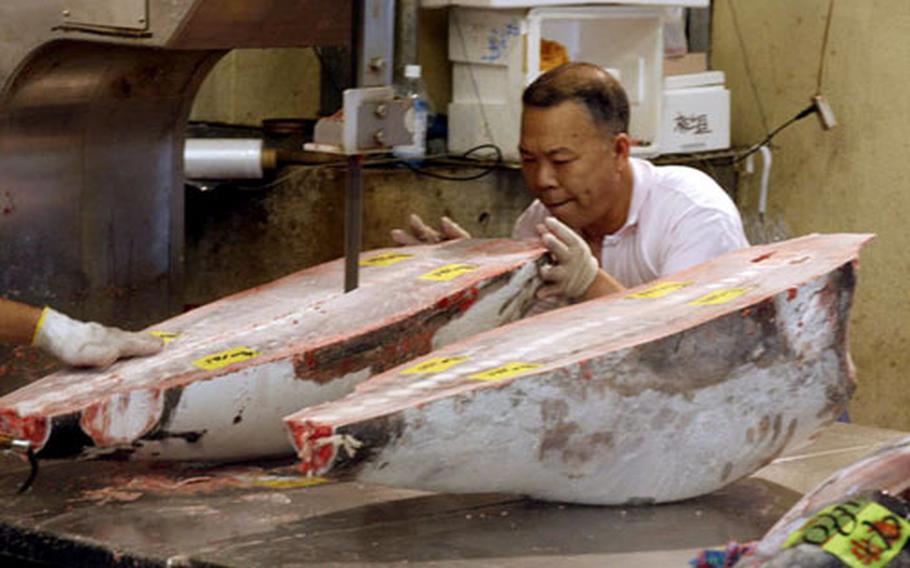 A fish is cut into sections before shipping.