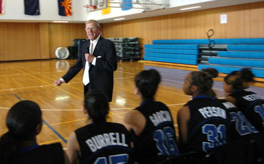 Former college football head coach Lou Holtz gives life advice to high school basketball players before their Far East tournament game at Camp Zama on Thursday. Earlier, the well-known coach also spoke with noncommissioned officers at a base leadership training.