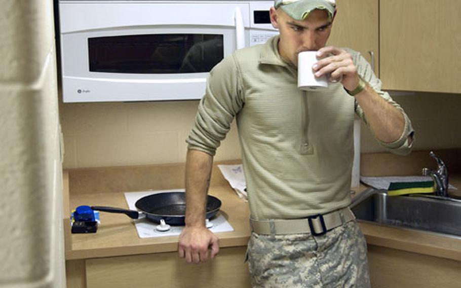 Spc. William Medlin sips coffee in his barracks in Fort Drum, N.Y., in October. Medlin, assigned to Company B, 2nd Battalion, 22nd Infantry Regiment, 1st Brigade, 10th Mountain Division, left Fort Drum as a newly married man in fall 2007 on a deployment to Kirkuk, Iraq. He returned home separated from his wife.