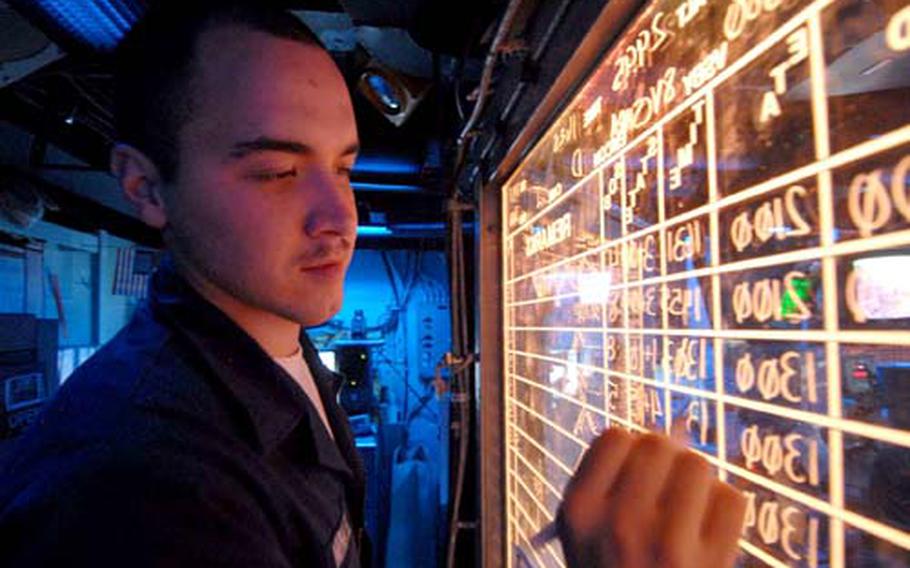 Sailor Adam Minkel tracks aircraft aboard the USS Essex on Jan. 29. Minkel traveled to the United States this month to donate bone marrow to a terminally ill child.