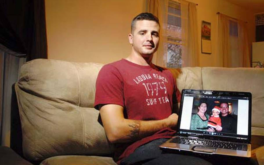 Pfc. Philip Vance shows off a photo of son Quenton and his parents for a portrait in his apartment Oct. 30th, 2008 near Watertown, NY. Vance, a medic that was attached to Company B, 2nd Battalion, 22nd Infantry Regiment, 1st Brigade, 10th Mountain Division, recently returned home from his deployment to Kirkuk, Iraq. Just before deploying, Vance's wife attempted suicide and was saved by Vance. With sole custody of Quenton, Vance plans on raising him as a single parent in the near future.