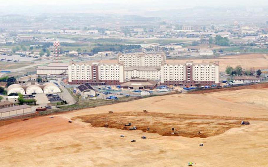 An aerial photograph from April 2008 shows Camp Humphreys in South Korea and part of the new land onto which the post will expand by 2012. The post is getting ready for a four-year, $450 million upgrade to its power grid, water lines and other key utilities.