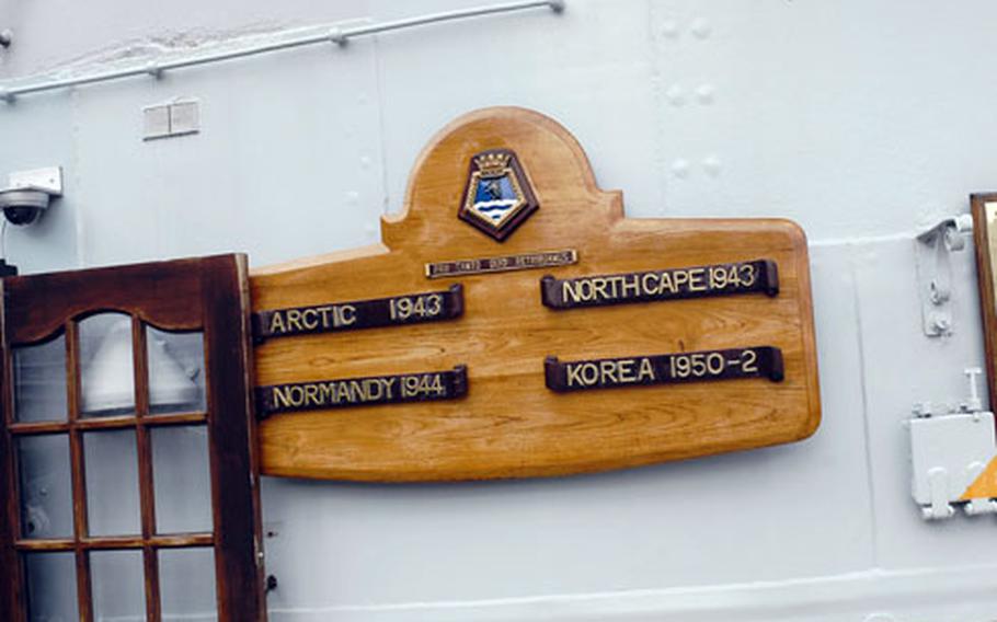 A sign aboard HMS Belfast notes its wartime record.