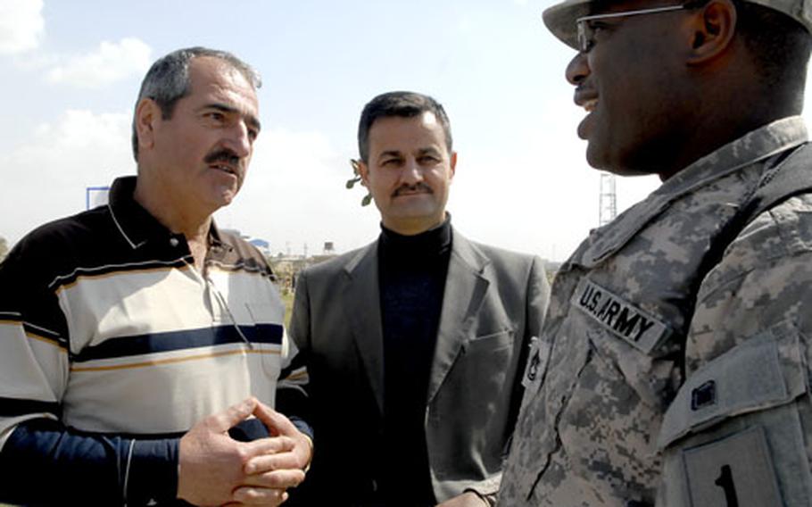 Sgt. 1st Class Octavius Brandon, right, talks to a Kurdish man who stopped him outside an Irbil festival. American troops get a much friendlier reception in Iraq’s Kurdish provinces than in much of the rest of the country and most Kurds ask for more U.S. troops, rather than a speedy withdrawal.