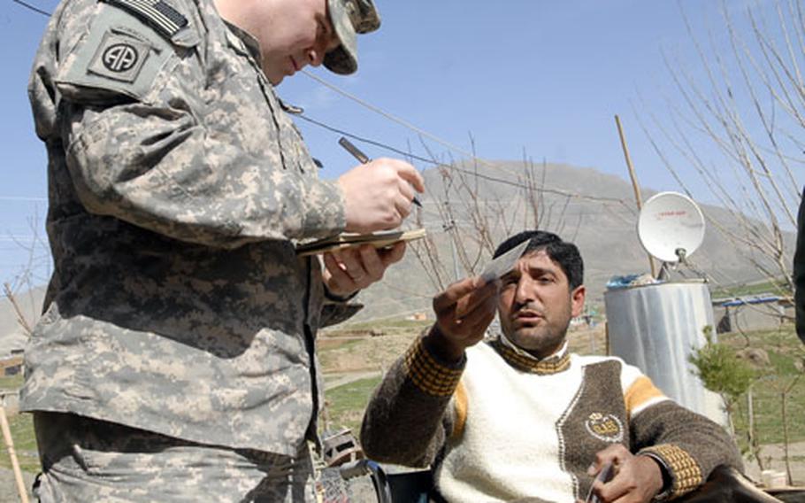 Maj. Jim Lawson, left, talks to a refugee living in Iraq&#39;s Kurdish semi-autonomous region. Lawson and other members of the 4100 Border Transition Team work on everything from training border guards to humanitarian efforts.