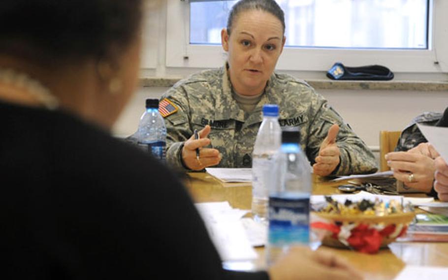 Jamie Gilmore, School Advisory Committee president at Germany’s Kaiserslautern High School, right, discusses a point with Principal Jennifer Beckwith. Gilmore, whose daughter is a senior, is a master sergeant with 21st Theater Sustainment Command.