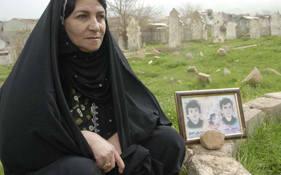 Nazira Mohammed Wasta Sharif, 50, sits at the grave of her three sons, all killed 21 years ago in the chemical attack on Halabja, in Iraq’s Sulaymaniyah province. The attack killed some 5,000 people, and the Kurdish city is still struggling to recover.