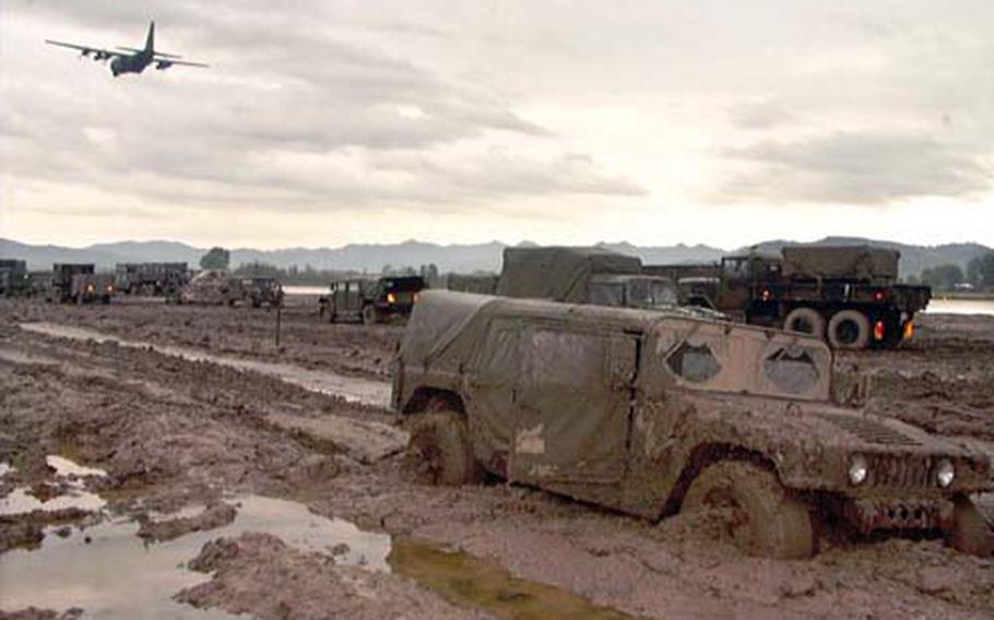 A Humvee is mired in the mud at Task Force Hawk in Tirana, Albania, in 1999. Two weeks into the deployment, the base camp was beginning to show signs of improvement, but the mud still wreaked havoc for those on the ground. In the end, the Germany-based task force and its fleet of 48 AH-64 attack helicopters never saw combat.