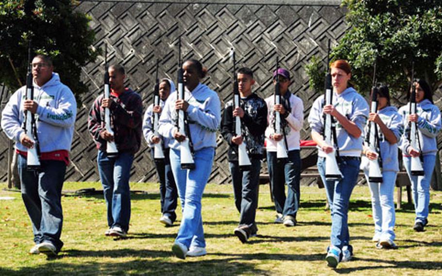 Kubasaki High School, Okinawa, students in the Junior Reserve Officer Training Corps drill team practice at Iwakuni on Monday.