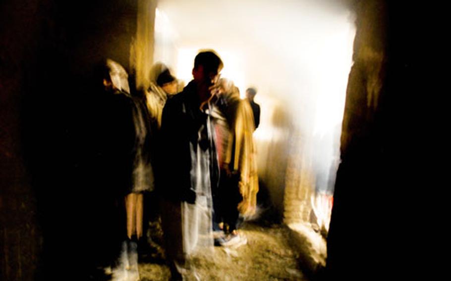 Mohammed Sherren, a Kabul police detective, leads the way toward the “shooting galleries” where heroin addicts cook and smoke heroin. Sherren said there’s little the police can do with the addicts.