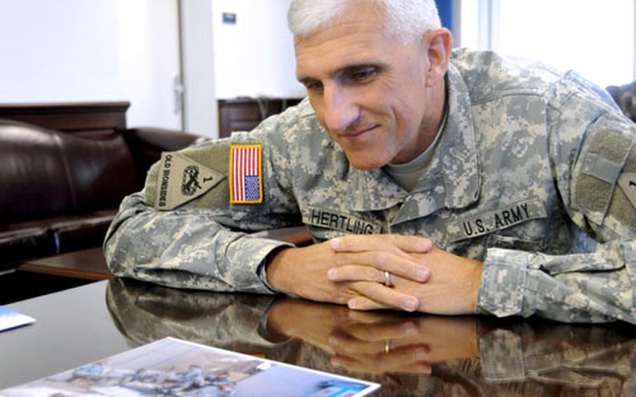 Maj. Gen Mark Hertling talks about a photo that shows a relaxed Command Sgt. Maj. Roger Blackwood talking to soldiers in Iraq. One of the soldiers was killed a short time later. The photo is one of Blackwood&#39;s and Hertling&#39;s favorite photos from the deployment.