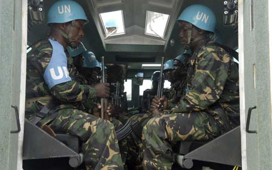 Tanzanian troops test one of the armored vehicles they’ll be taking with them to Darfur for an upcoming peacekeeping tour. The U.S. and Great Britain supplied the Tanzanian military with $9 million in vehicles and other equipment for the Darfur deployment.