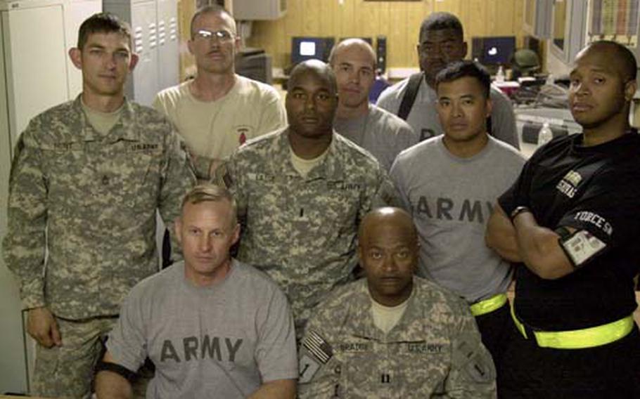 Team Force, an Army team created to train border guards in Iraq, lost their leader, Maj. Steven Hutchinson, in a roadside bomb on May 10. Picture are, from left to right, standing: Sgt. 1st Class Andrew Hunt, 31, of Yelm, Wash.; Sgt. 1st Class David Rieckmann, 37, Manhattan, Kan.; 1st Lt. Jeremy Eaddy, 28, Maxton, N.C.; Capt. Brandon Skinner, 31, Texarkana, Texas; Staff Sgt. Demetric Gandy, 30, Georgiana, Ala.; Capt. Dennis Mercado, 29, Guam; Staff Sgt. Rivas Nestor, 27, Paterson, N.J. Seated: Sgt. 1st Class Damon Smith (left), 40, San Antonio, and Capt. Sidney Braddy, 42, Warthen, Ga. Chief Warrant Officer 2 Elext Holmes was in Fort Riley, Kan., this week to speak at a memorial service for Hutchinson.