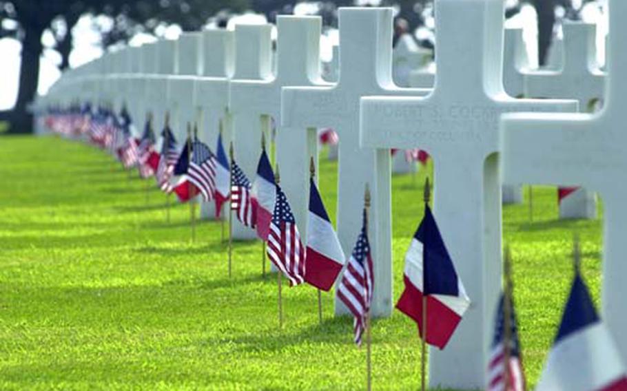 American and French flags decorate rows upon rows of American graves at the Normandy American Cemetery at Colleville-sur-Mer, France. The cemetery will host the main U.S. ceremony commemorating the 65th anniversary of D-Day at 2:30 p.m. on June 6. President Barack Obama is scheduled to attend.