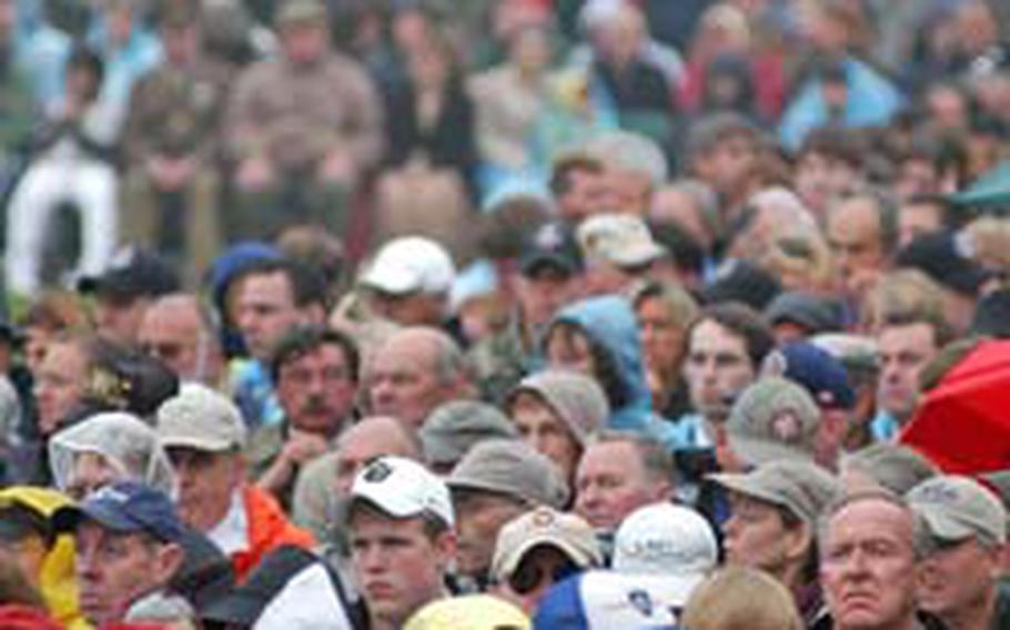 Thousands watch the ceremony commemorating the 63rd anniversary of D-Day and dedication of the Normandy American Visitor Center at Normandy American Cemetery in Colleville-sur-Mer, France, in 2007.