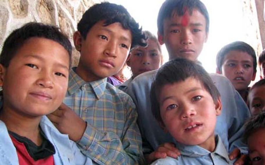 Nepalese school children gather for a visit by Susan Blake, an elementary school counselor from Misawa Air Base, Japan. Blake helped begin a fundraising project to assist the children.