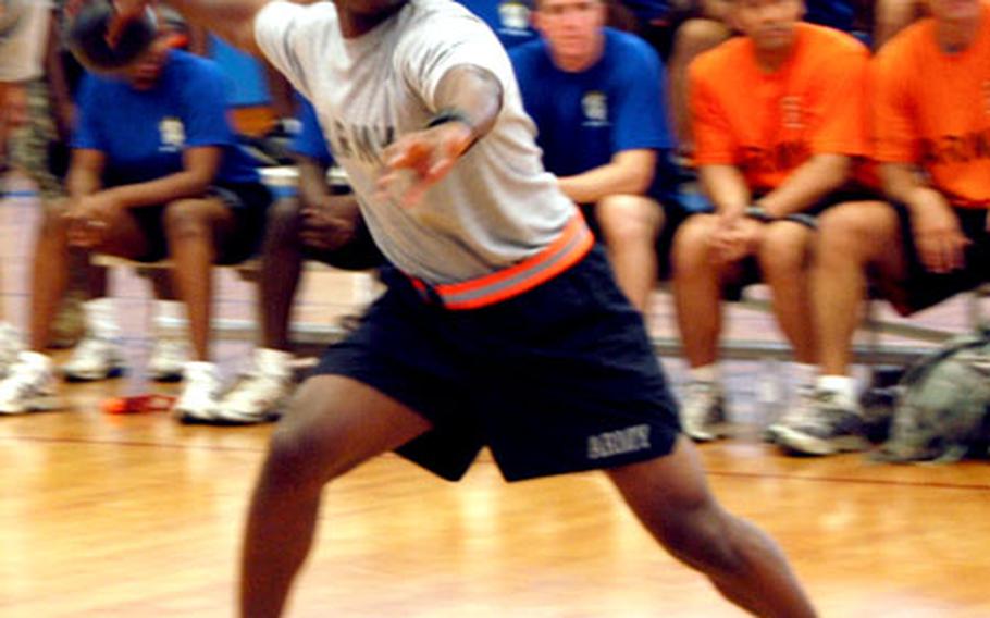 Army 2nd Lt. Sylvio Personna, of Echo Battery, 1-1 Air Defense Artillery Battalion prepares to chuck a rubber ball Tuesday during a dodgeball competition Tuesday at Risner Gym on Kadena Air Base. The game was one of several activities planned for Army on Okinawa week.