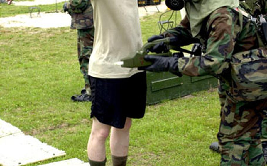 A soldier is tested for chemical contamination during the chemical-attack-response exercise.