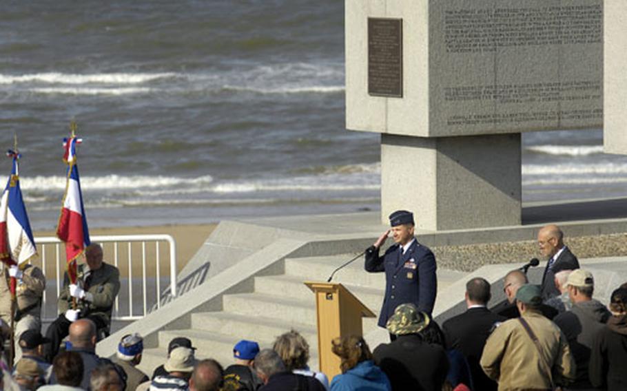 During a memorial ceremony held Friday near Omaha Beach, Maj. Gen. Tod Bunting, adjutant general, Joint Forces Headquarters, Kansas National Guard, salutes veterans who fought on the beaches of Normandy