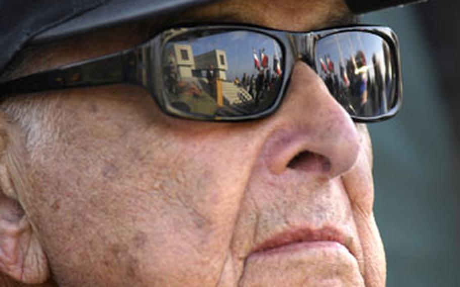 Hal Baumgarten, 84, listens during a memorial ceremony honoring the sacrifices National Guard soldiers made on D-Day. Baumgarten, a keynote speaker at the event, was one of only two soldiers from his boat who made it through the day on June 6, 1944.