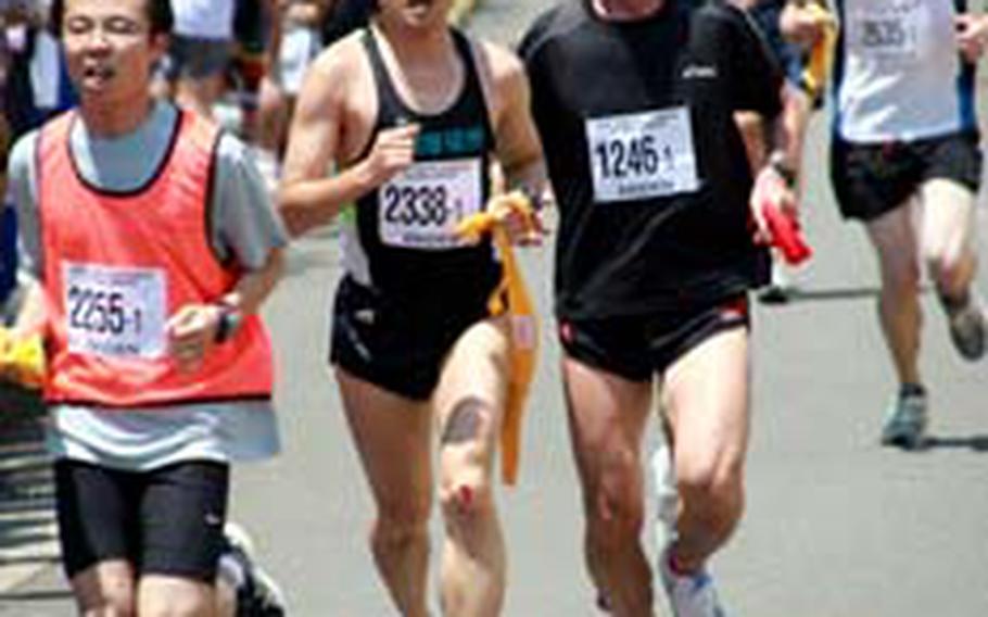 Runners hit the home stretch of their relay handoff.
