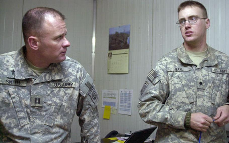 Capt. Mike Smith, the battalion&#39;s chaplain, talks with Spc. Richard Wahl in his office. The 20-year-old was worried recently about his pregnant wife, who needed to go to the doctor and didn&#39;t have a babysitter for the other two kids. Smith&#39;s wife ended up helping her get to the doctor.