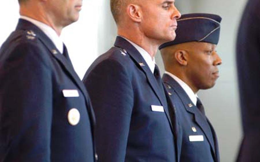 Maj. Gen. Mark Zamzow, vice commander of the 3rd Air Force, from left, Brig. Gen. Craig Franklin and Col. Charles Q. Brown stand at attention during a change of command ceremony Tuesday at Aviano Air Base in Italy. Brown took over for Franklin.