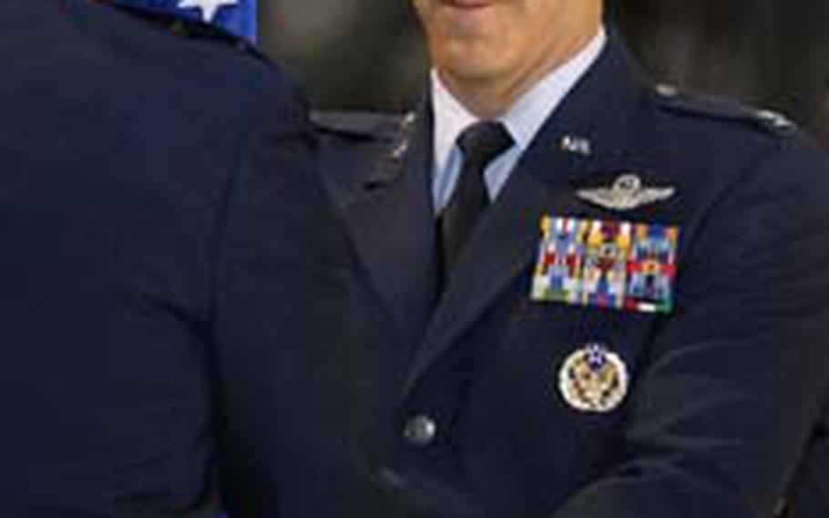 Col. Thomas Gould receives the guidon from Maj. Gen. Mark Zamzow, 3rd Air Force vice commander.