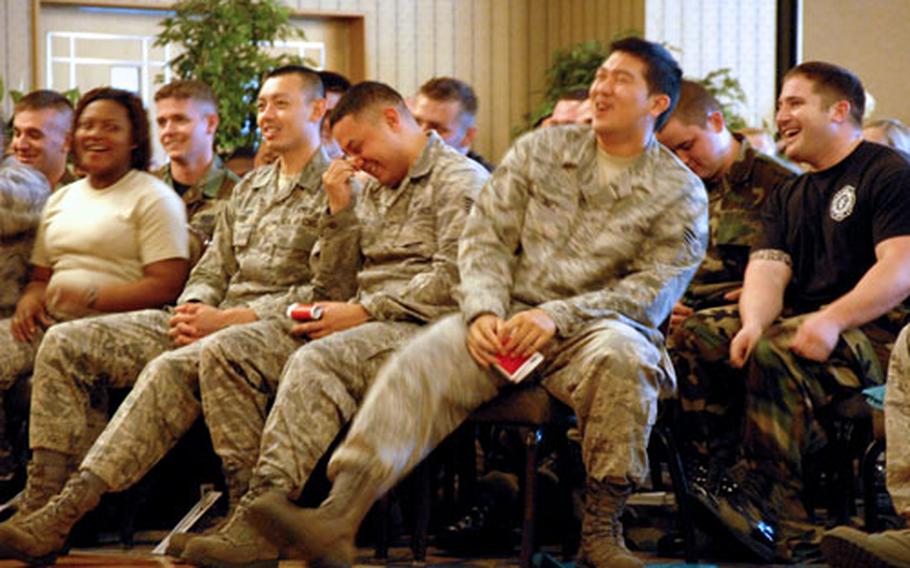 Airmen at Misawa Air Base, Japan, laugh during a presentation of “Sex Signals” on Friday.