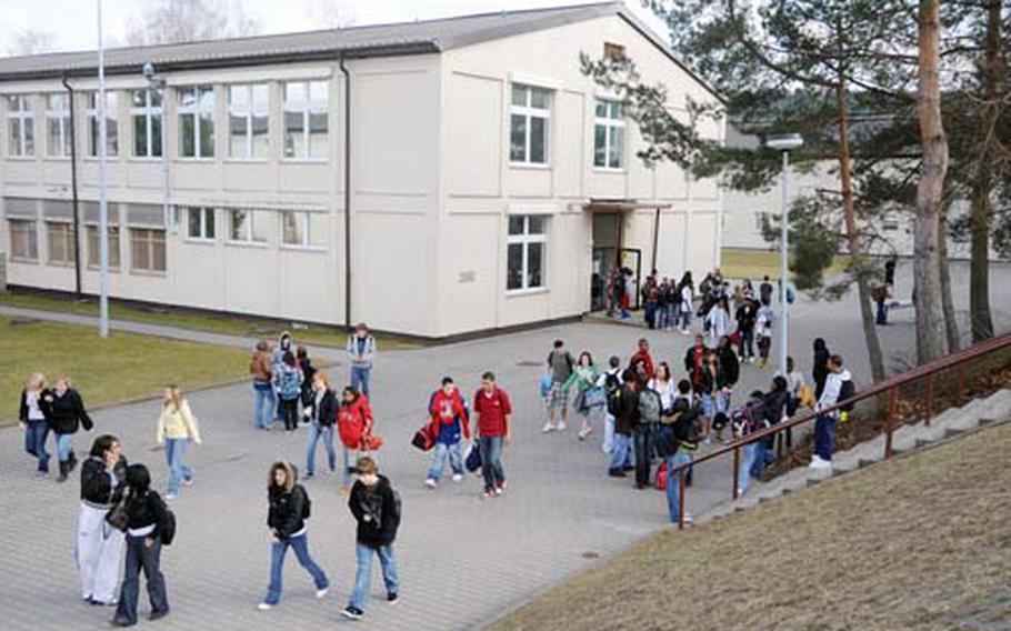 Kaiserslautern High School students mill around after school in March. When the Kaiserslautern Military Community Center opens in Ramstein, the Vogelweh base exchange and adjoining buildings will be torn down to make way for a new DODDS facility.