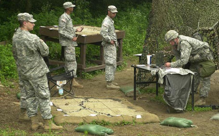 A candidate prepares to call in indirect fire on a target during Expert Infantry Badge testing Wednesday at Camp Casey.