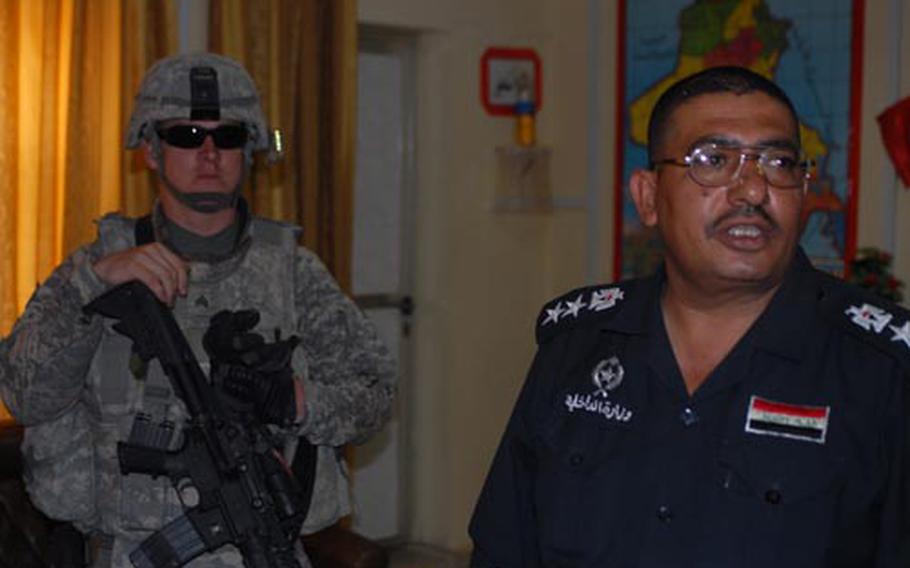 Sgt. Chris Dowling of 2nd Platoon, 563rd Military Police Company met with Col. Ghassan Hashem Muhammad of the Iraqi Highway Patrol in Babil province on Monday.