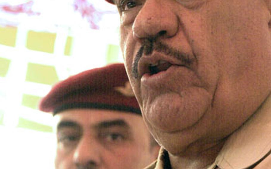 Gen. Abud Kambar al-Malliki, right, the top Iraqi Army commander in Baghdad, warned terrorists to “stay in your homes” or face a fight as U.S. troops pull back from Iraq’s cities at the end of June. “We are ready to fight you if you try to attack our citizens,” he said Saturday during a ceremony to mark the Americans’ departure from a base on the edge of Sadr City. “We will find you in every corner where you hide.”